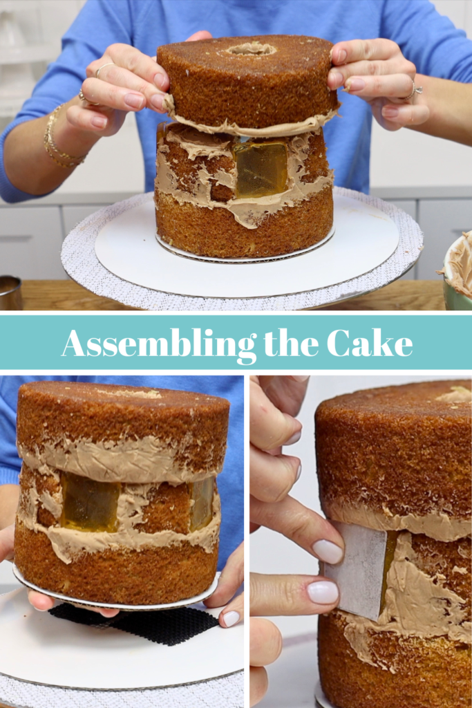 Layering cake and chocolate buttercream to build the base of a cake gingerbread house