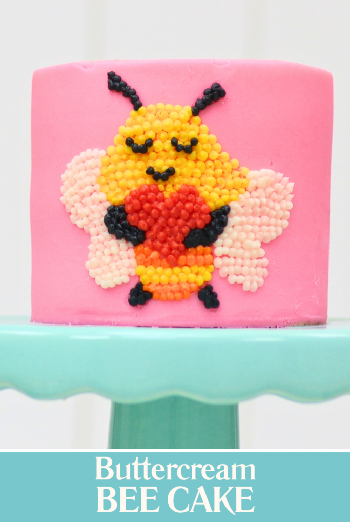 Finished buttercream bee cake made with pointillism piping, a cute example of Valentine’s Day cake ideas using simple buttercream techniques