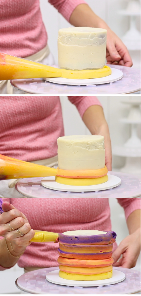 Piping layered buttercream onto a cake to create a smooth ombre effect for Valentine’s Day cake ideas