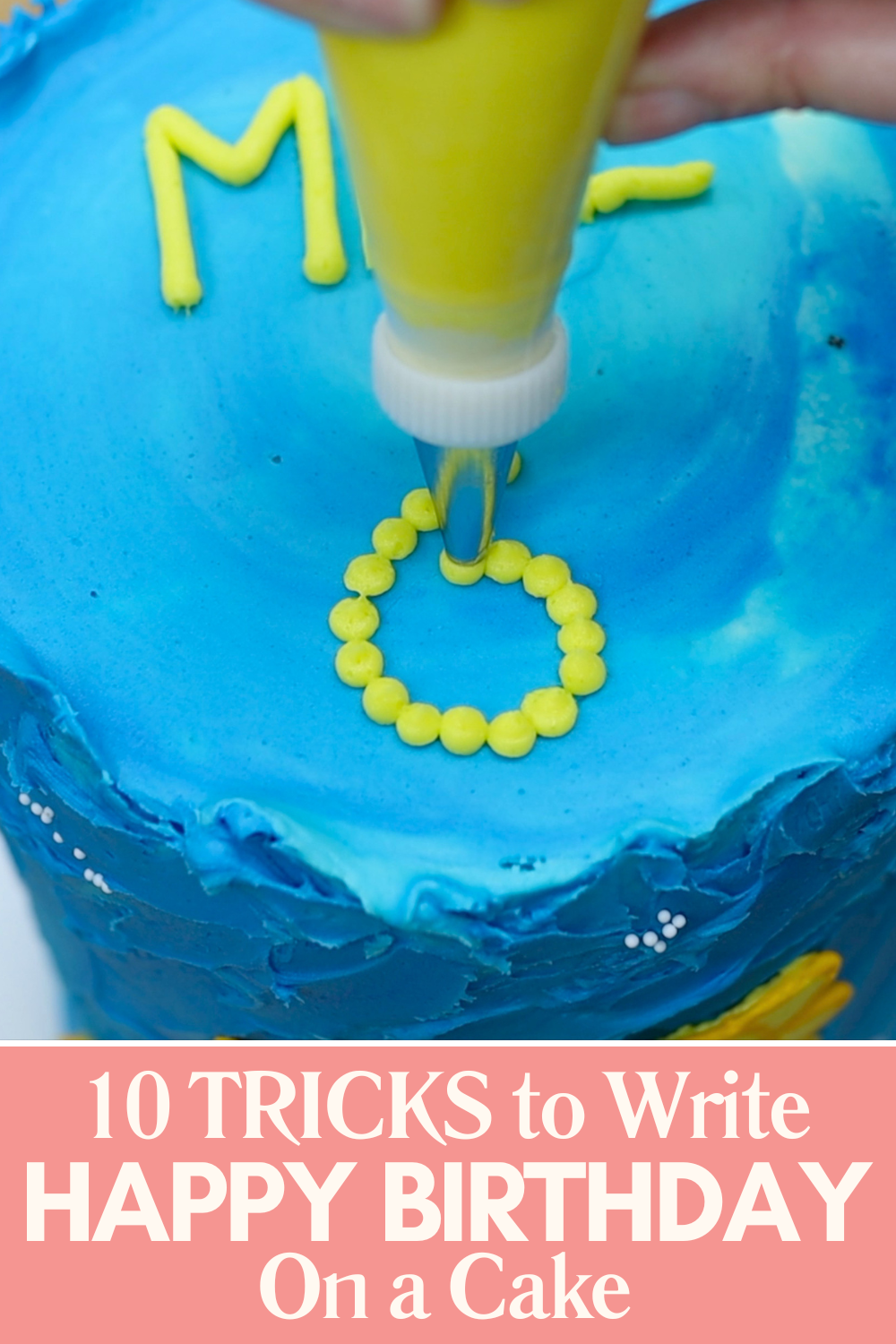 Piping dots to form letters and numbers on a cake using the pointillist buttercream technique