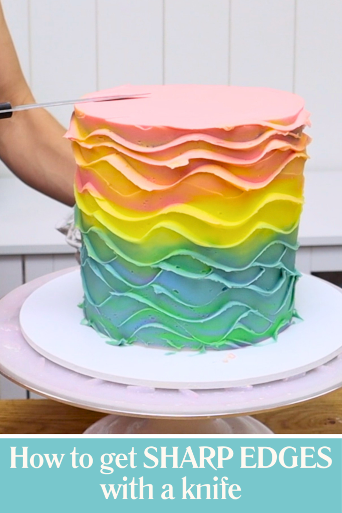 Rainbow buttercream cake with sharp edges created using a knife