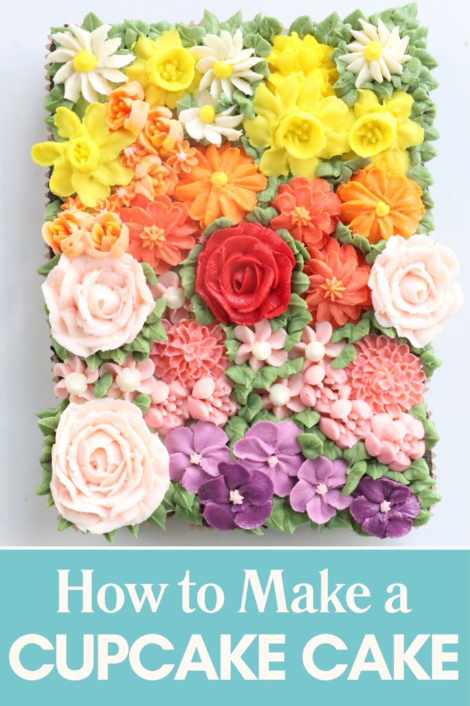 Finished pull-apart cupcake cake covered with colourful piped buttercream flowers.